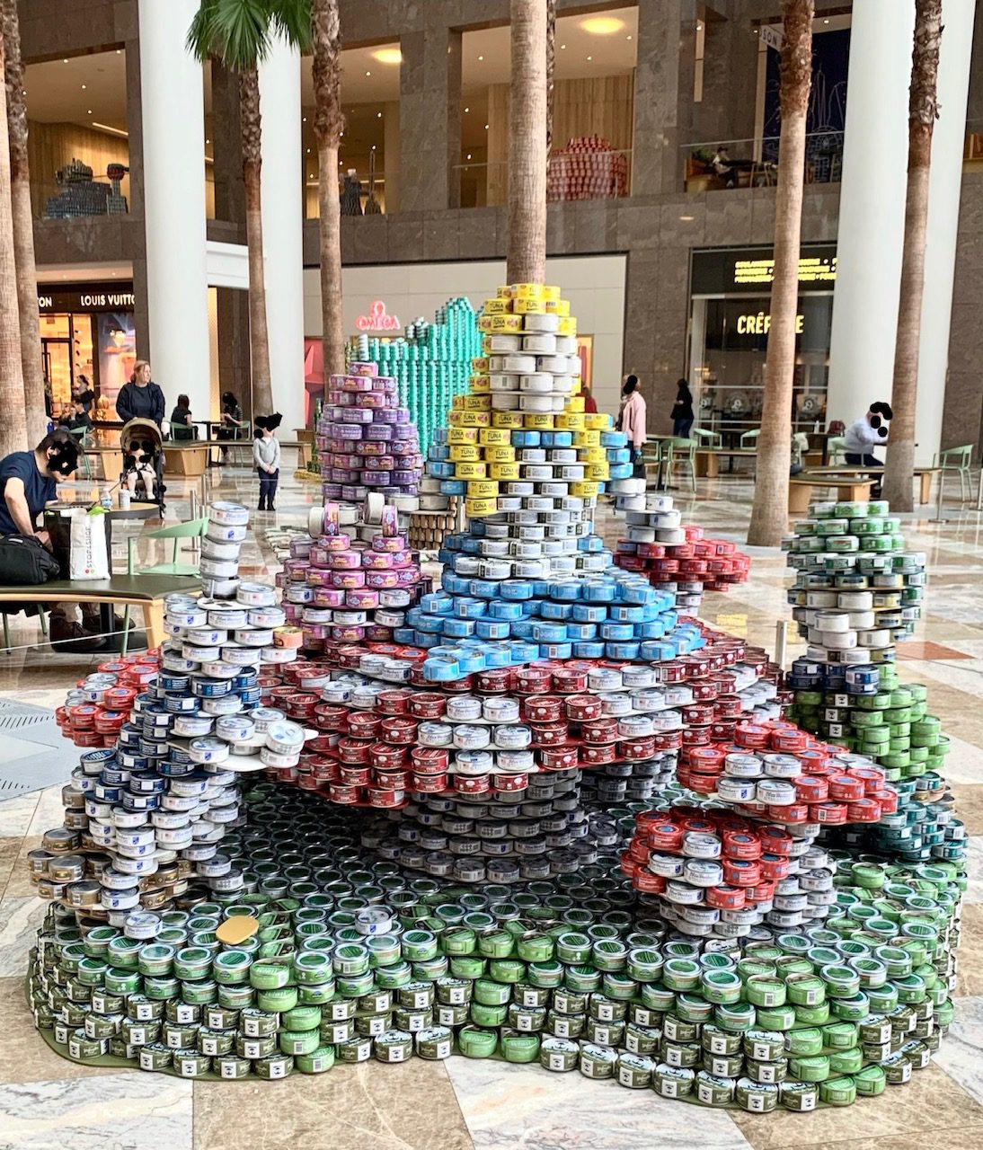 Alice in Wondercan sculpture at CANstruction 2024 exhibit